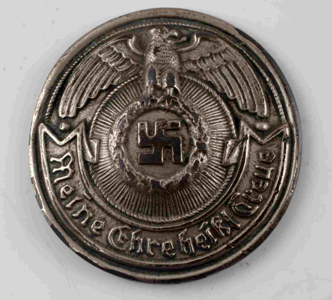 WWII THIRD REICH GERMAN SS BELT BUCKLE COVER: Eagle holding swastika with 'Meine Ehre heiBt Treue' to front, RZM SS marked to back with two posts. Measures 1 7/8 inches in diameter. Unauthenticated, sold as is.
