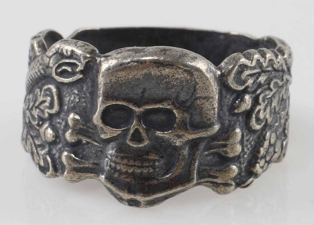 WWII GERMAN WAFFEN SS ANTI PARTISAN WARFARE RING: Silver ring with Totenkopf to center and snake and leaf pattern to each side, stamped 800 for silver content, size 12, weighs 7.4 grams. Very good condition. Unauthenticated, sold as is. This lot has 