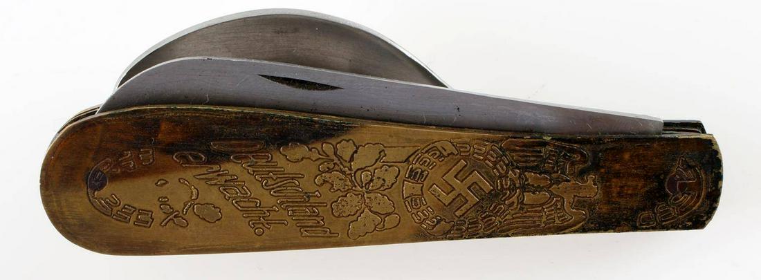 WWII GERMAN 1933 ELECTION PROPAGANDA POCKET KNIFE: Two-blade knife with spoon, engraved design to front, soldier helmet marking to bottom of blade. When closed, measures 4 inches long. Good condition. Unauthenticated, sold as is. This lot has a reserv