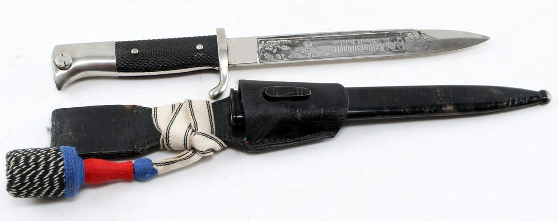 WWII GERMAN SS LEIBSTANDARTE ADOLF HITLER BAYONET: German Dress bayonet by Alcoso with etched SS Leibstandarte Adolf Hitler, their key and shield symbol, a Reichsadler, and oak leaves on the blade. Blade is in great shape. Scabbard has about 85% paint
