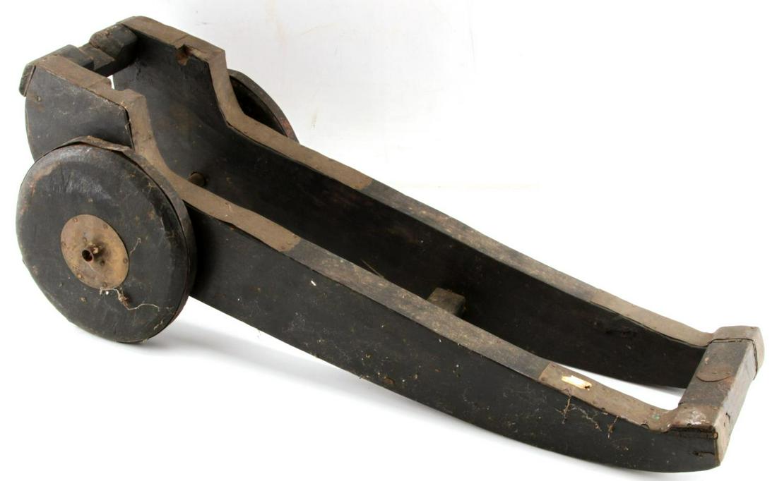 ANTIQUE DECK CANNON CARRIAGE WOOD & BRASS 24X6X9": Designed for small deck of signal cannon the, trunion wheel the cannon sits the slots measures 4.5 inches, the connon slot is 1 3/4 inches. Wheels are hand carved and has flat steel tire, quite unusua