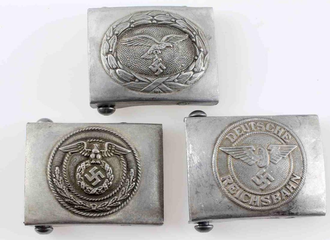 WWII GERMAN THIRD REICH BELT BUCKLE LOT OF 3: This lot includes 1 Luftwaffe, 1 Reichsbahn, and 1 SA belt buckle. Each is reverse "RZM" marked and is in very good condition overall. Some minor corrosion and signs of use present. Unauthenticated; s