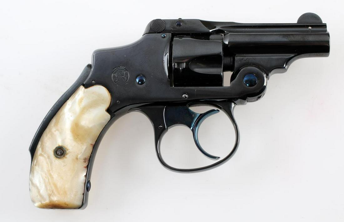 SMITH & WESSON .32 CF BICYCLE HAMMERLESS REVOLVER: Smith & Wesson .32 CF Bicycle hammerless lemon squeezer safety revolver. 5 shot cylinder with a 2 inch barrel. In good condition with mother of pearl grips. Likely re-blued but functions very well mec