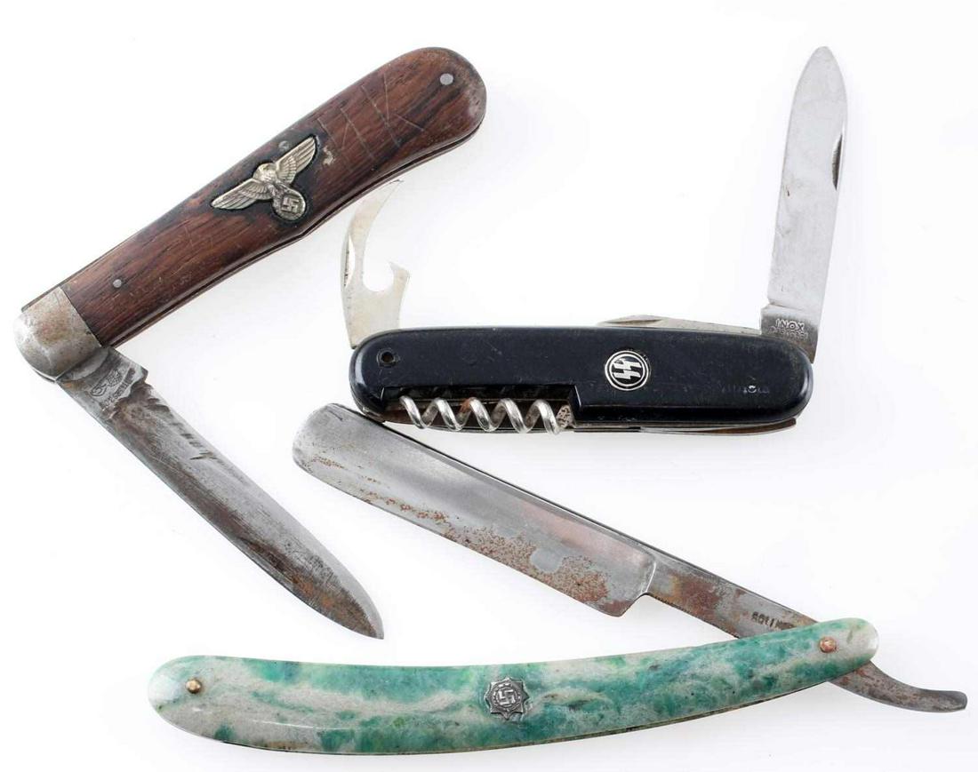 WWII GERMAN THIRD REICH NSDAP KNIFE RAZOR LOT OF 3: Lot contains 2 knives and a razor from the 3rd Reich. Includes a Victorinox style knife with SS runes. Second is a wooden-handle Solingen knife with a Reichsadler on the handle. The razor is Solingen