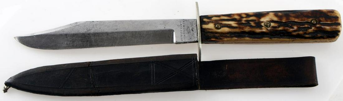 VINTAGE J RUSSELL GREEN RIVER SMALL BOWIE KNIFE: Vintage J Russell Green River small bowie knife. 6 inch blade. Stag handle. With leather scabbard. Shows J Russell branding and maker's mark. Very good condition. 630