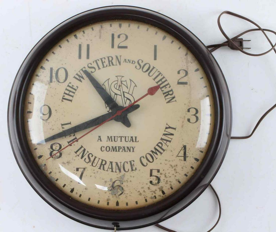 WESTERN AND SOUTHERN LIFE INSURANCE CO CLOCK: Electric wall clock circa 1960's , works, some paint loss to face, 14 inch diameter.