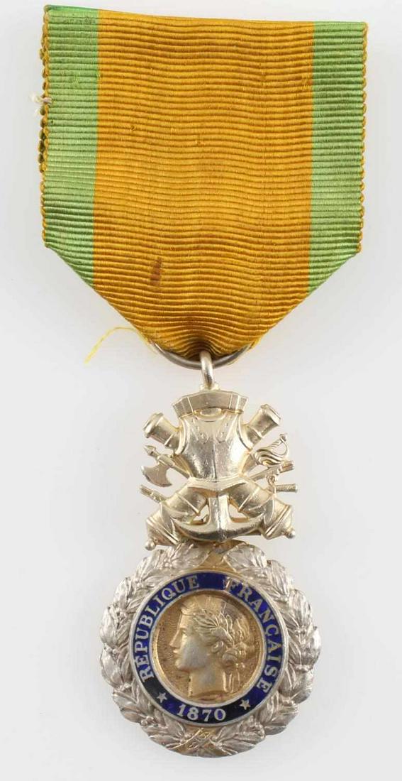 FRANCO PRUSSIAN WAR 1870 FRENCH MEDAILLE MILITAIRE: French Republican version of the 1870 Franco-Prussian War Medaille Militaire. Measures 1 1/16x2 inches in size. Includes presentation cloth ribbon. Two-piece brass construction with blue enamel. In ve