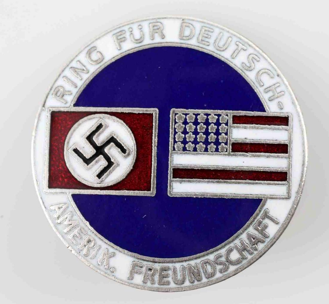 WWII GERMAN THIRD REICH AMERICAN BUND PARTY BADGE: German-American Bund party badge. Measures 1 1/16 inches in diameter. Reverse is maker marked 'CTD'. Has a thin horizontal safety pin back. Nickel construction with enamel. In very good condition. Una