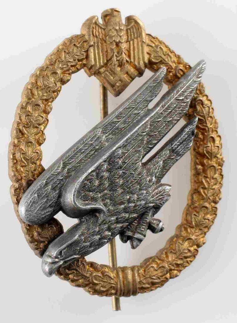 WWII THIRD REICH GERMAN ARMY PARATROOPER BADGE: Two-toned unmarked Junker type with bearded eagle. High domed rivets. Thin vertical pin back with c-hook closure. Very good condition. Unauthenticated, sold as is. This lot has a reserve.
