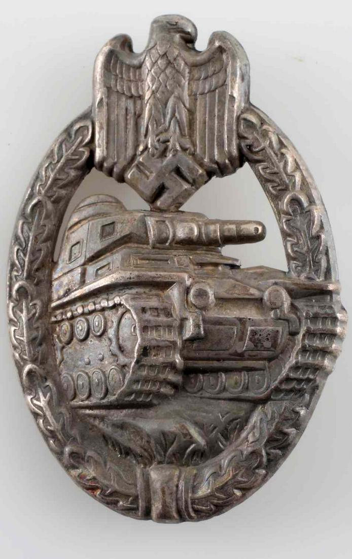 WWII GERMAN 3RD REICH SILVER PANZER ASSAULT BADGE: German Panzer Assault badge. Unmarked with thin vertical pin back. Stamped nickel construction. Awarded for three combat encounters with the enemy. In very good condition with some patina present. Una
