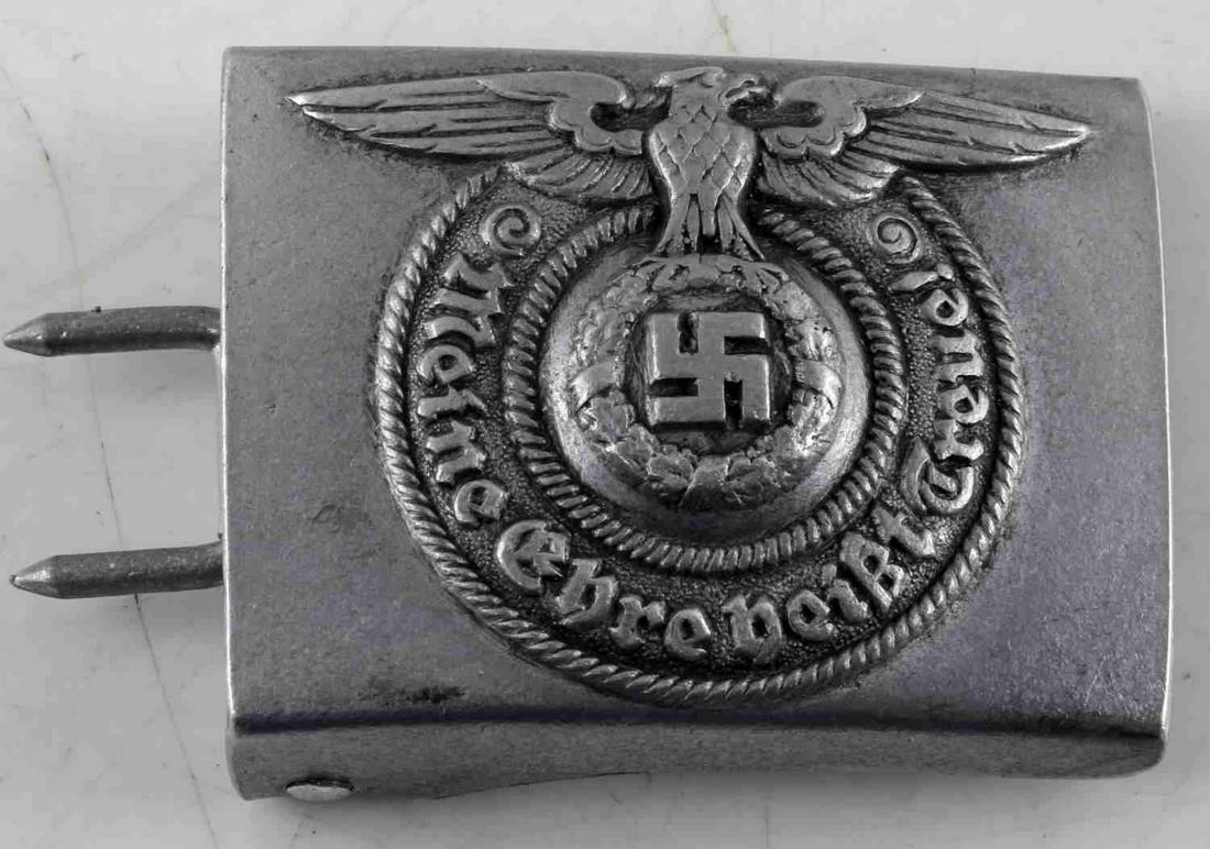 WWII GERMAN THIRD REICH SS EM BELT BUCKLE: Belt buckle of an SS enlisted man. Measures 2 7/16 inches wide by 1 7/8 inches tall. Reverse is maker marked 'RZM 822/37 SS'. Aluminum construction. For an enlisted man. In very good condition. Unauth