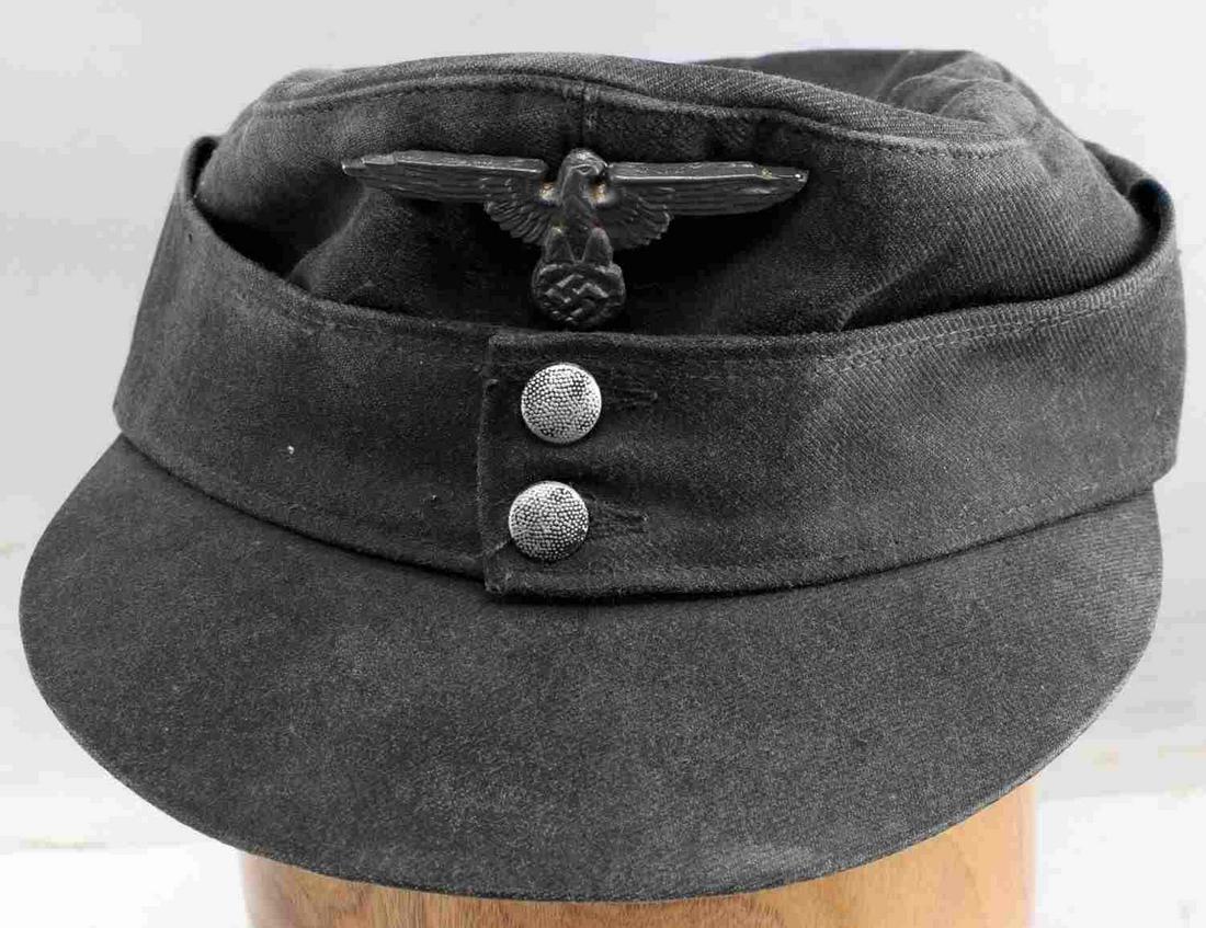 WWII GERMAN THIRD REICH HEER FIELD CAP M43: WWII German Third Reich Heer Field Cap. Made from denim, not the traditional wool or cotton. Missing cockade, and the Reichsadler is not fabric but a metal pin. Does not fluoresce. Very good condition