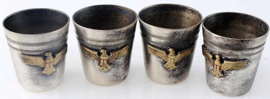 WWII GERMAN ARMY HEER LOT OF 4 SCHNAPPS CUPS: Silver tone cups with Nazi eagle affixed to front, symbol and MET marked to bottom, measures 1.5 inches tall. Very good condition. Unauthenticated, sold as is. This lot has a reserve.