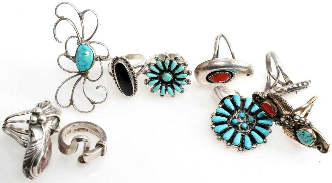 9 PIECE NATIVE AMERICAN & MEXICAN STERLING JEWELRY: Large sterling and turquoise ring size 8.5. Sterling and mother of pearl size 5.5 signed "R" Starburst pattern turquoise ring size 5. Zuni coral and sterling bear ring size 7.5. Sterling, coral, turqu