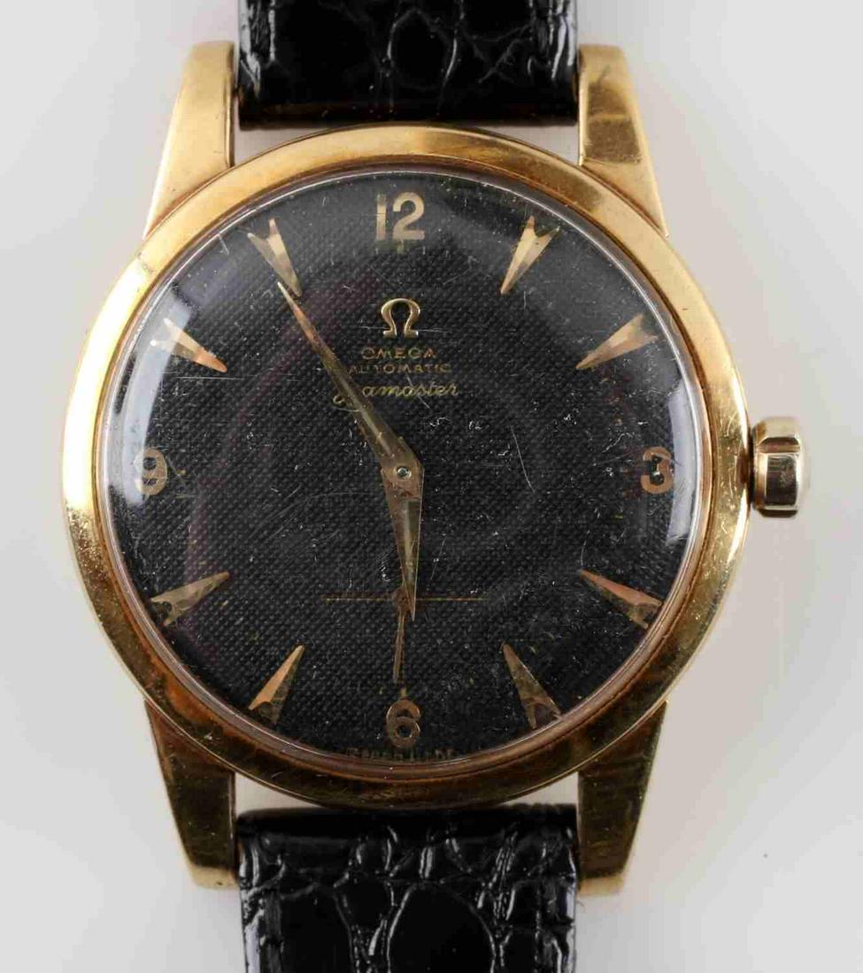 18K VINTAGE OMEGA AUTOMATIC SEAMASTER MENS WATCH: 17 jewels. Serial number: 12419778. On black leather band. Measures 9.25 inches. Watch is in working condition and keeping good time. Jeweler assessed it had a blown gasket so will need servicing.