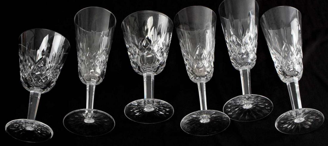 LOT OF 6 WATERFORD CRYSTAL GLASSES LISMORE WINE: Lot includes: 4 champagne flutes (7 3/8 inches) and 2 wine glasses (6 inch). One flute has a tiny chip to rim. Otherwise, very good condition.