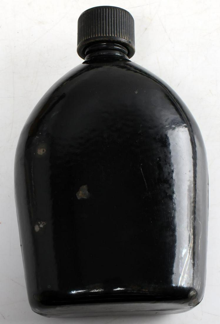 WWII US 1942 PAINTED BLACK METAL CANTEEN KEELER CO: Painted black canteen, inside of cap is marked 'US 1943 Keeler Brass Co. Grd Rapids', bottom is marked 'US Vollrath 1942.' Measures 8 X 4.5 inches. Good condition. This lot has a reserve.