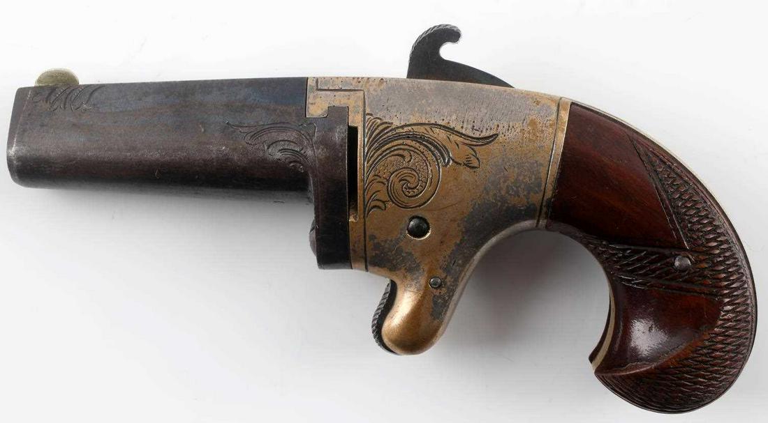 ANTIQUE NATIONAL ARMS CO DERINGER 41 CAL PISTOL: National Arms Co. Number 2 Deringer single shot pistol. .41 Caliber rimfire. Marked "National Arms CO. Brooklyn, NY" on top of barrel. Engraved frame and barrel. Walnut grips, spur trigger, and birds 