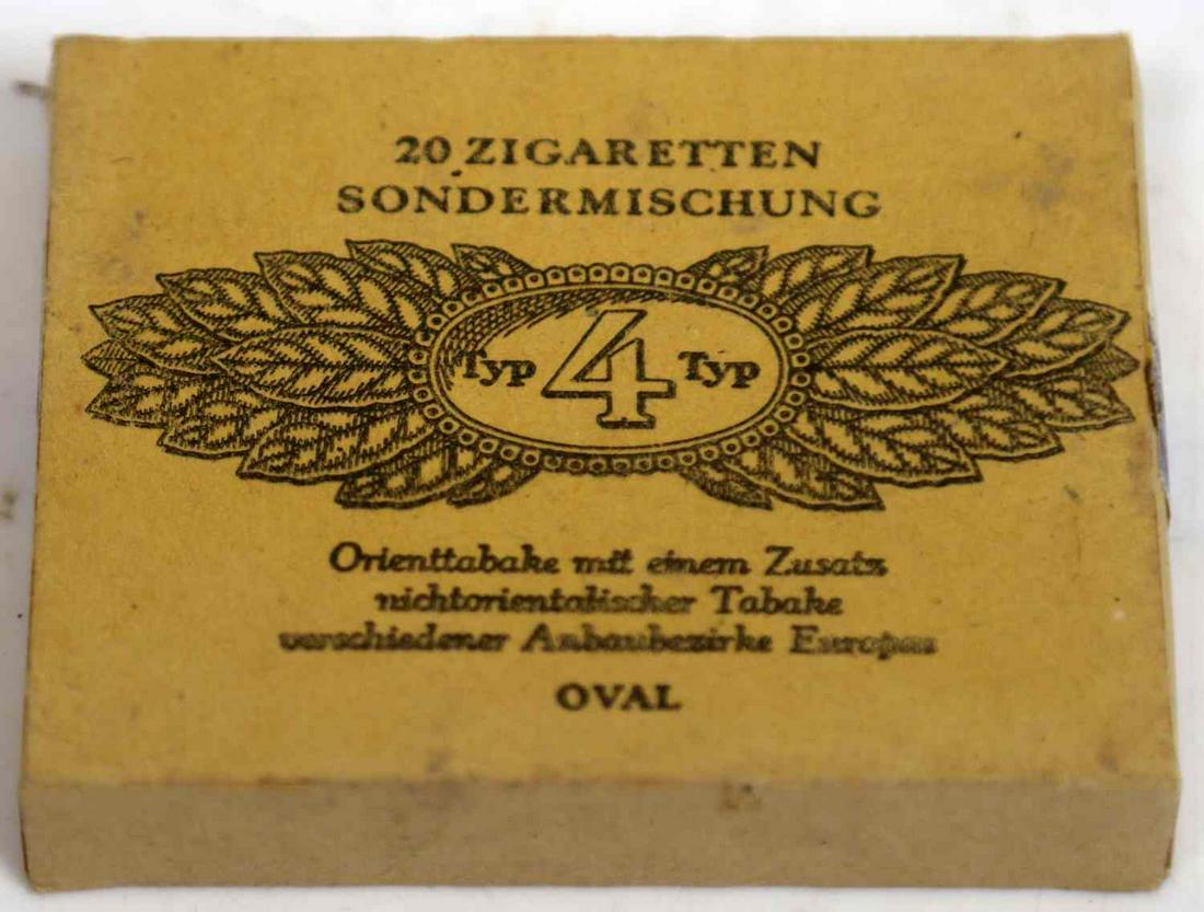WWII GERMAN THIRD REICH UNOPENED SS CIGARETTE PACK: Unopened box of SS cigarettes. Hardstock container with brand "Typ 4 Typ". Tax stamp has printed double S sig runes.