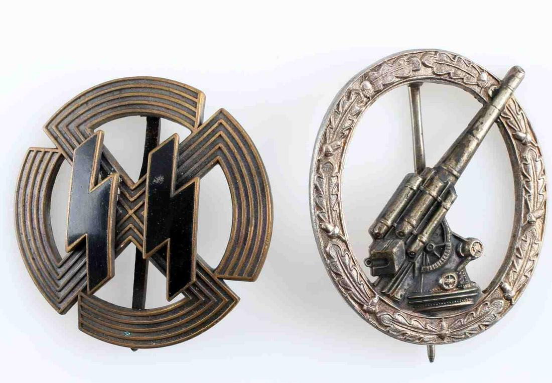 LOT OF 2 WWII GERMAN BADGES PROFICIENCY ARTILLERY: One SS bronze Sports Proficiency badge with SS runes to front, Sieper & Sohne maker, and RZM M1/25 mark. One Luftwaffe Flak Artillery badge with tank to center and oak leaf wreath, nickel construction