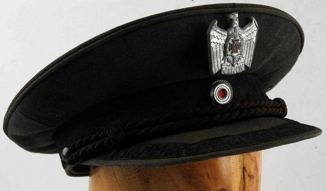 WWII GERMAN THIRD REICH NSKOV VISOR CAP: Visor cap with an NSKOV badge on it. In very good condition. The leather sweat band is split in two places all the way through and has a few other smaller cracks. Does not fluoresce under blacklight. 