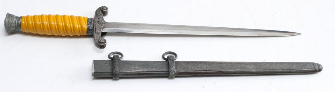 WWII GERMAN THIRD REICH HEER ARMY DAGGER: German heer dagger by WKC, Solingen. In good condition with fine bakelite grips and gray pebbled scabbard. This example has been purposefully de-nazified and has had the swastika cut from the Reichsad