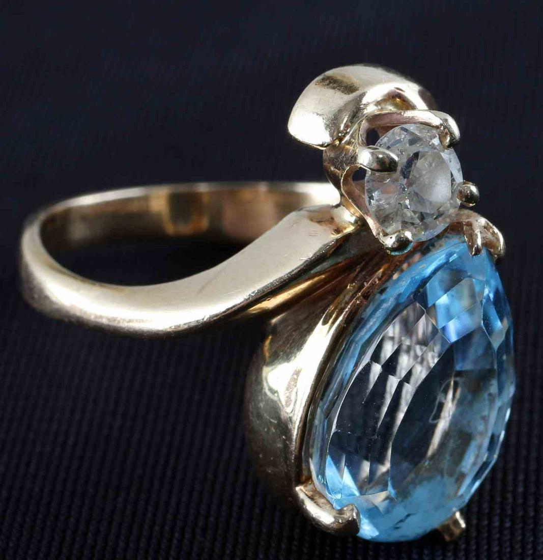 LADIES 14K YELLOW GOLD DIAMOND & TOPAZ RING: 5 carat pear cut topaz and set above 5 mm round cut diamond. .46 diamond TCW. Clarity: VS2 - SI1 Color: J-K. Weight: 8.2 grams. Size: 8._