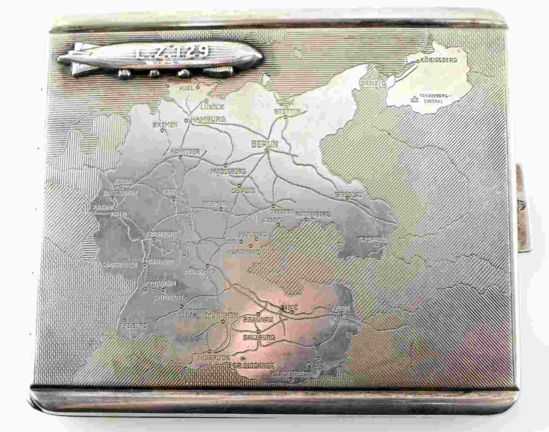 WWII GERMAN ZEPPELIN ENGRAVED CIGARETTE CASE: Shows Zeppelin LZ129 with German map on front. Engraved inside with "Ernst Lehmann Fur Treue Dienste" Measures 3.5 inches by 3 inches._