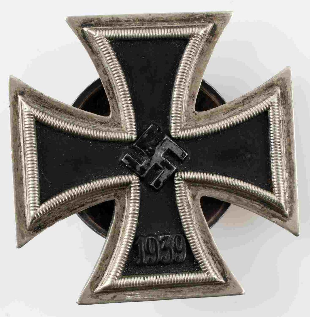 GERMAN WWII IRON CROSS 1ST CLASS BADGE SCREW PIN: WWII German Iron Cross First Class badge with screw back. The swastika coating is partially chipped off. No identifiable maker's mark. In very good original condition._