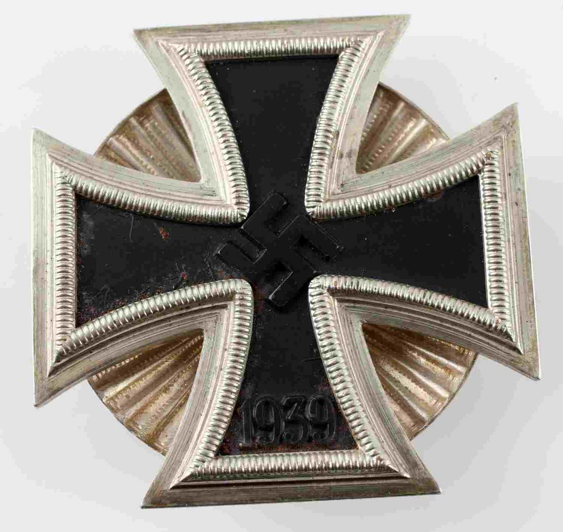 GERMAN WWII IRON CROSS 1ST CLASS BADGE SCREW PIN: WWII German Iron Cross First Class badge with screw back. The face of the badge has some scratching and discoloration. No identifying maker's mark. The badge is in very good original condition._