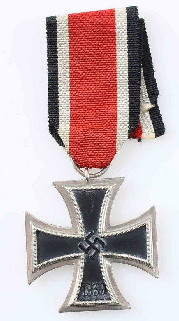 GERMAN WWII IRON CROSS 2ND CLASS RIBBON: WWII German Iron Cross Second Class with ribbon. Iron cross is in very good condition. Core is magnetic. No maker's mark present. Ribbon is discolored, and one end is partially frayed. Ribbon does not