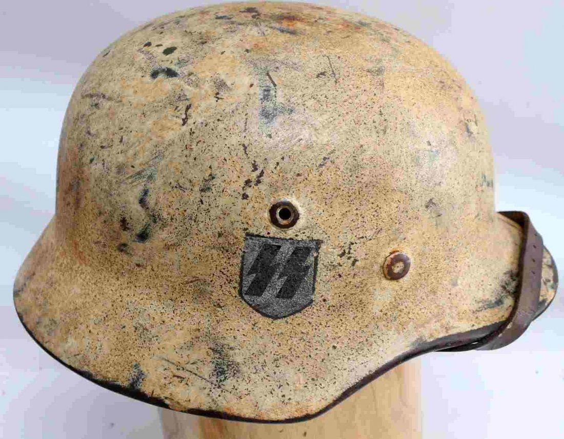 WWII GERMAN WAFFEN SS TROPICAL STAHLHELM HELMET: German SS M40 helmet. Tropical Tan 79 paint with tri color shield and SS decals. Maker marked "Q64" at its left side for the maker F.W. Quist / Esslingen and the size 64. Also marked "DN186" at its re