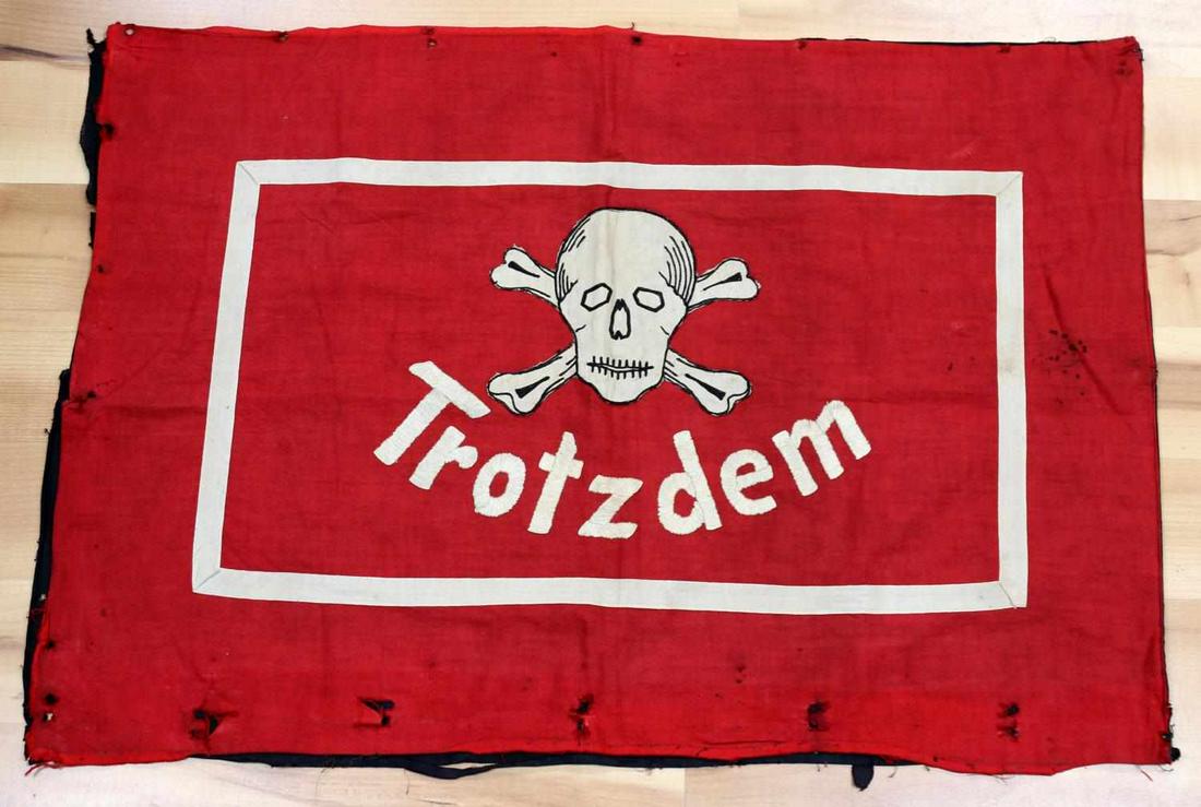 WWII GERMAN HITLERYOUTH JUNGVOLK BANNER FLAG: Town of Trotzdem Deutsches Jungvolk banner with the unit in the upper left corner. Single sig rune Jungvolk rune at one side with totenkopf and town name at the other. Multi piece cloth construction w