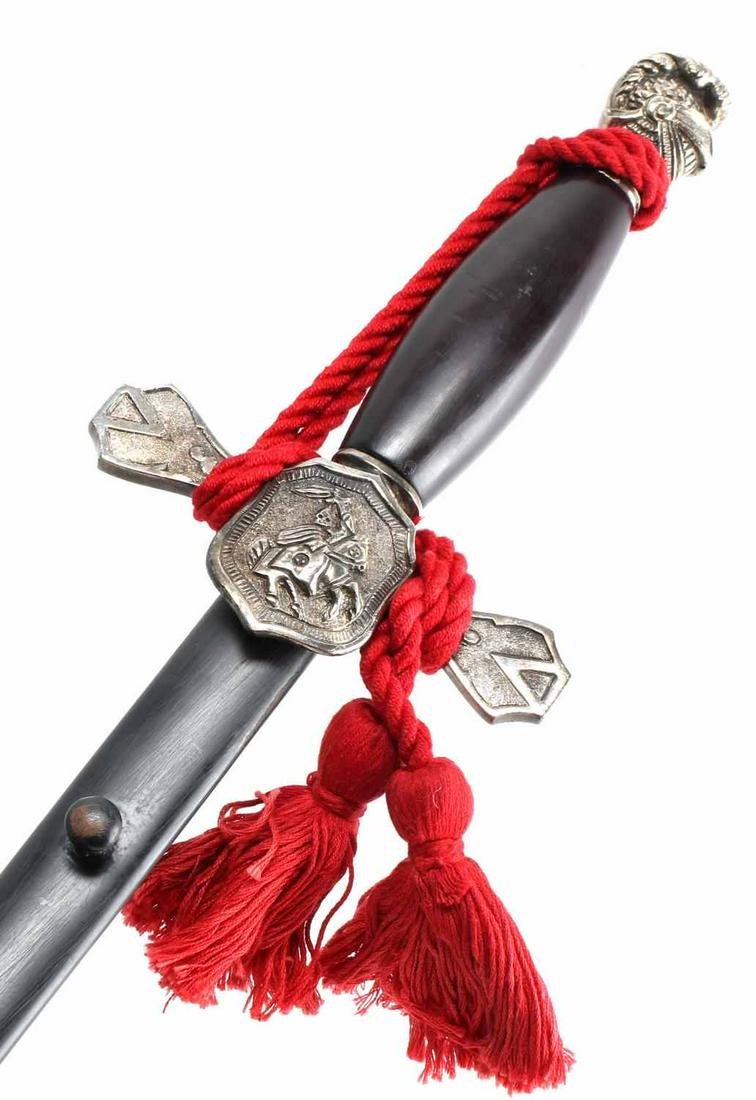 KKK OFFICER KNIGHT RIDER SWORD ANTIQUE RED KNOT: KKK Men's Knight Rider sword from 1920s-30s. Double edged sword with a visored knight's head on the end of the grip. Has red sword knot to denote second degree officer rank. Has minor paint chips on s