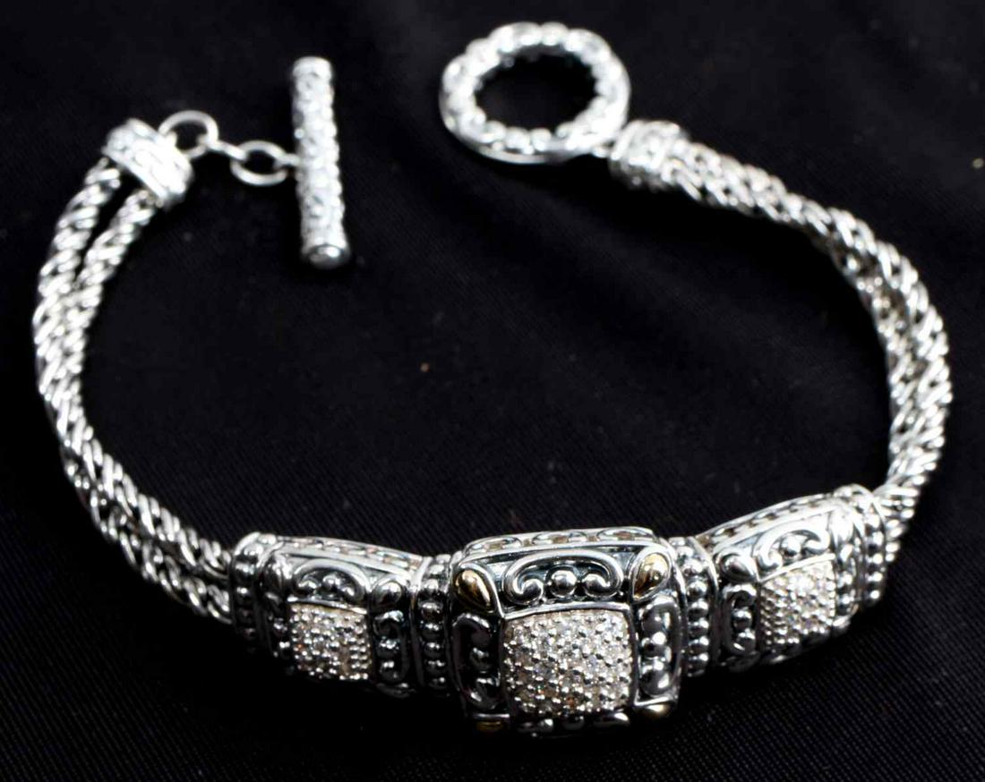 JOHN HARDY STERLING SILVER & 14K GOLD ACCENTS: Sterling silver bracelet with toggle clasp and 14k yellow gold accents. Measures 7.25 inches.