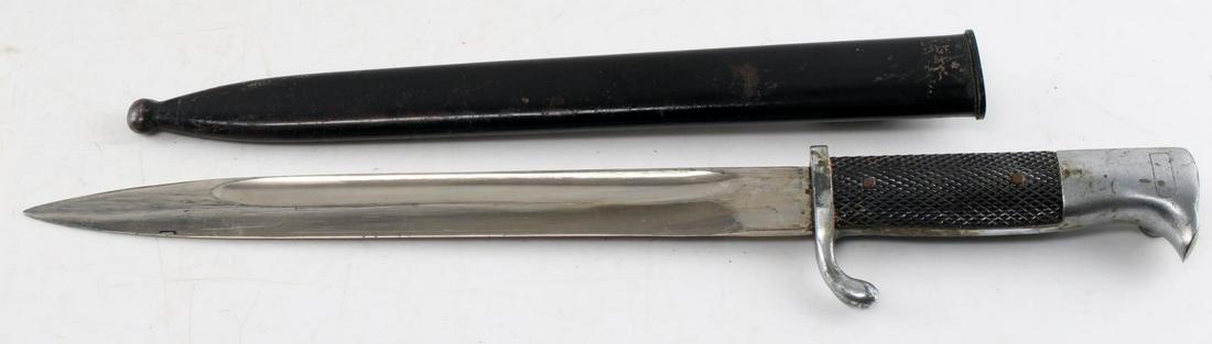 WWII THIRD REICH GERMAN SS ENGRAVED BAYONET HOLLER: Meine Ehre Heisst Treue etched to 9 7/8 inch blade, along with shield with SS runes and key on it. FW Holler Solingen maker mark to ricasso. Little oxidation on hilt. Scabbard has original paint. Good