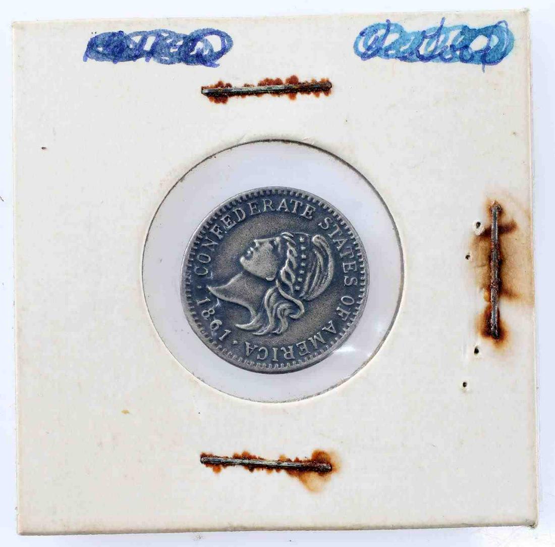 1861 CONFEDERATE DIME 1/10 TOKEN METAL COIN: 1861 Confederate dime. Obverse has a design similar to the capped bust design with "Confederate States of American" in surround with 1861 date. Reverse has "1/10" surrounded by a wreath. Likely one of