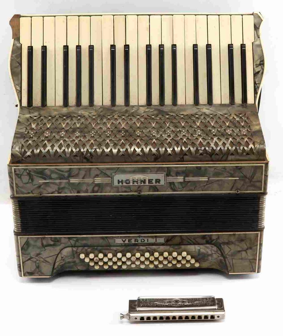 M HOHNER HARMONICA & HOHNER VERDI I ACCORDION: M. Hohner "Super Chromonica" harmonica. Small dent on top. Hohner Verdi I piano accordion. In good condition with two keys jutting out.