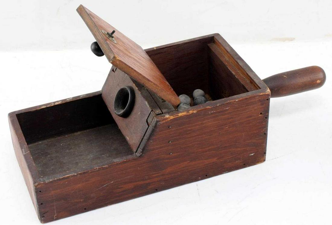 19TH CENTURY FRATERNAL WOODEN BLACK BALL BOX: 19th century fraternal wooden black ball box. 17.5 inches long and 6 inches wide. Comes with 20 black balls. Handle measures 5 inches. Commonly used for voting practices. Good condition.