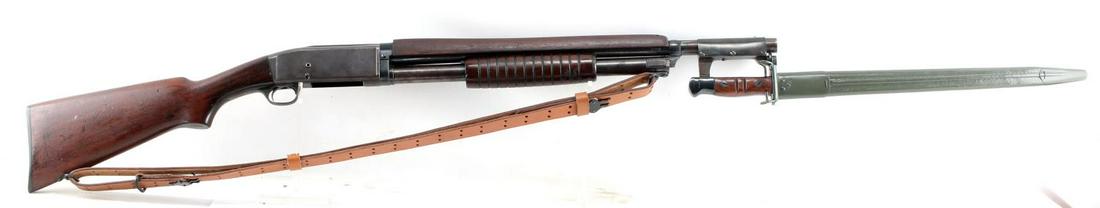 REMINGTON MODEL 10 PUMP ACTION SHOTGUN 12 GA: 1908-1929 production. Reworked pump action shotgun with 1917 bayonet, blued steel has brown patina, wood stocks (top forestock has been replaced), maker, model and serial no. marked to left side recei