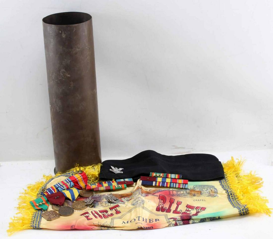 LOT WWII TO MODERN MILITARIA MEDAL & INSIGNIA LOT: Lot includes 1944 artillery shell, Fort Riley Kansas sweetheart pillow case, Naval petty officer 2nd class cap, misc. ribbon bars