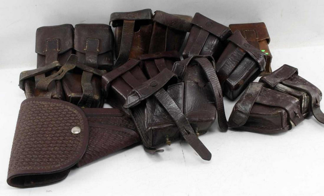 COLD WAR MAUSER AMMO POUCH LOT OF NINE: Cold War Mauser ammo pouch lot of nine. Six Mauser 8MM pouches. Two Cold War era Mauser ammo pouches and a Viking Mexico Colt holster stamped 7205 80. Good condition overall.