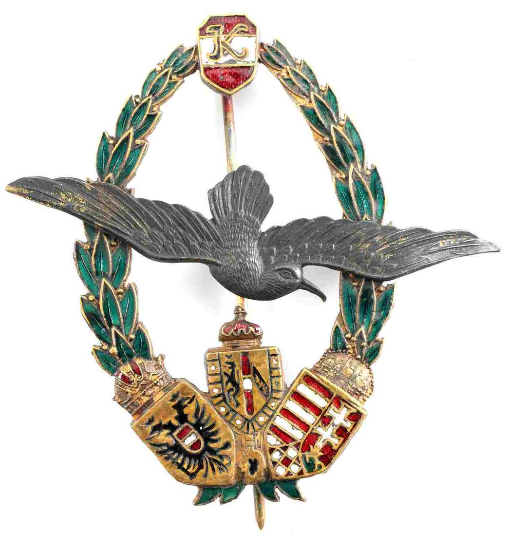 WWII AUSTRIAN KAISER KARL NAVY PILOTS BADGE: WWI Austrian Kaiser Karl Navy Pilots Badge. Large and multi-enameled. Measures 2.5 inches long and 2.5 inch wingspan. Riveted construction with multi-colored enamels. Makers mark of Zimbler Wien. Very