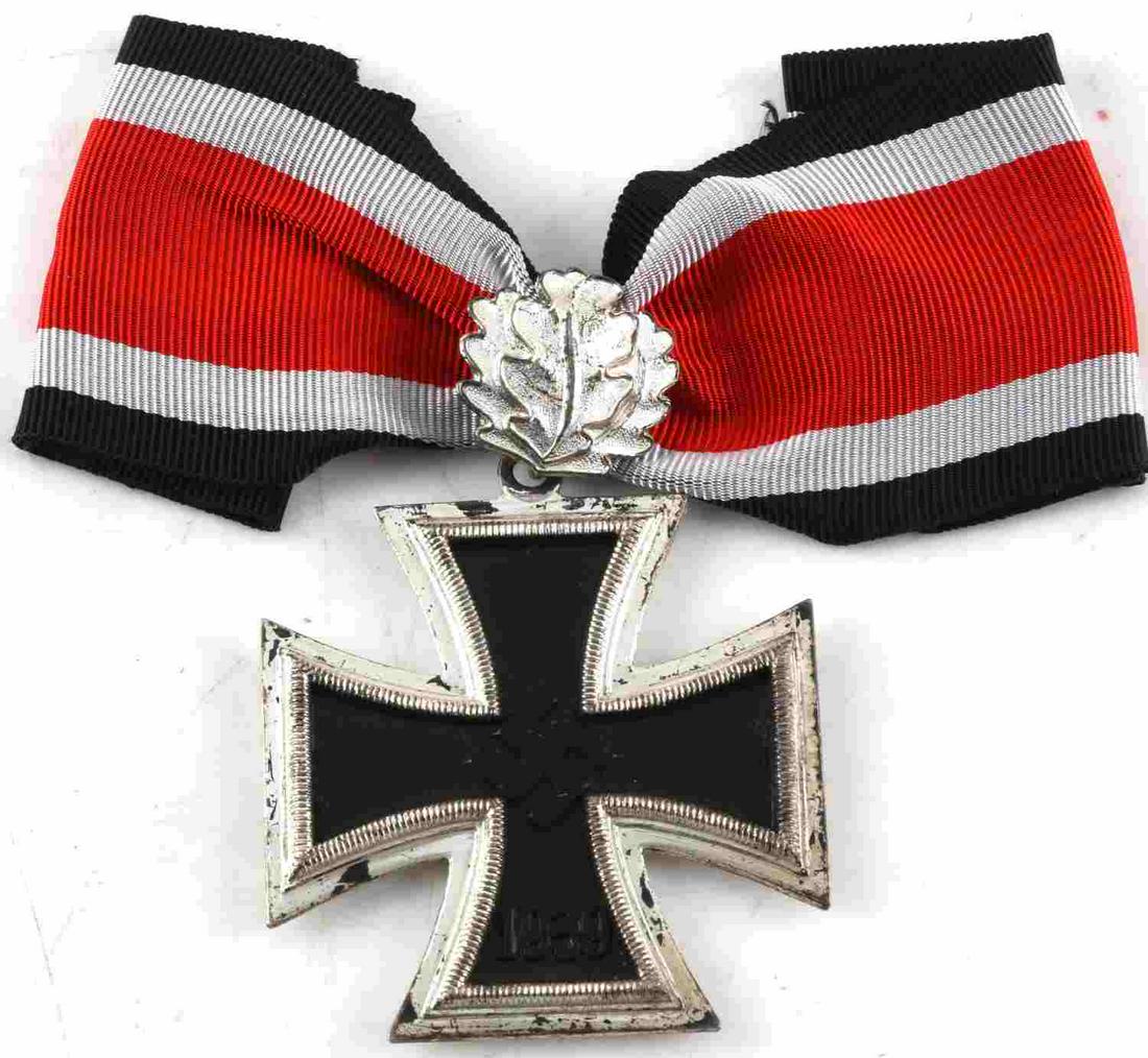 WWII GERMAN THIRD REICH KNIGHTS CROSS IRON CROSS: Knights Cross of the Iron Cross medal with Oak Leaves. Cross measures 1 15/16 inches square. Reverse upper arm is marked '800' for the silver content. Three-piece construction with magnetic core. Incl