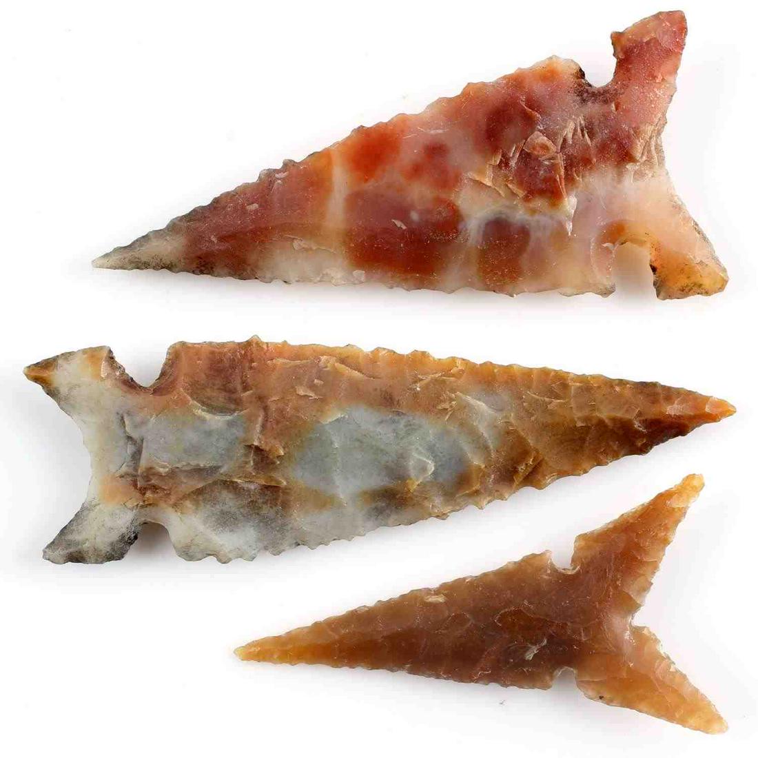 LOT OF THREE SMALL NICELY CARVED ARROWHEADS: Two Northern Wolf Ears points. Both of mottled lithic. One measuring 1.5 inches. One measuring 1.75 inches. Both in very good condition and found in Tulare Lake, California from 1940s. One Desert Delt