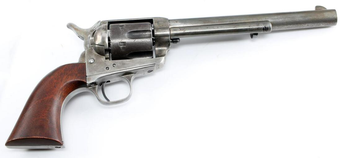 COLT SAA 6 SHOT REVOLVER .44 40 W WOOD GRIPS: 1890 production. Grey patina, black powder frame, patent dates marked to left side frame with Jan. 19, 75 as the last, wood grips, model and caliber marked to left side barrel, barrel measures 7.5 inc
