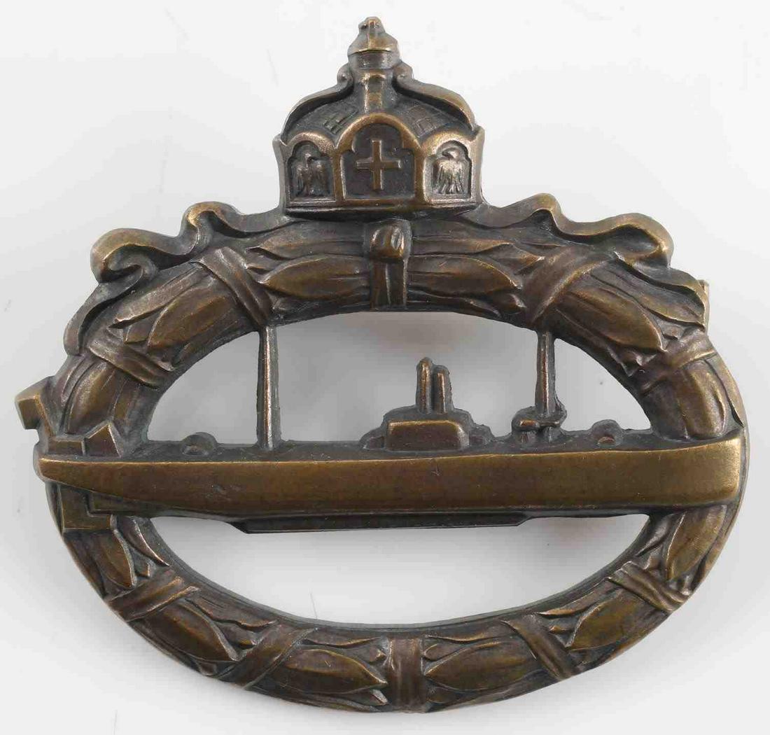 WWI IMPERIAL GERMAN U-BOAT BADGE IN BRONZE: WWI German U-boat badge. Massive type made from cannon brass. Reverse marked "Walter Schott fec." In very good condition. A scarce example. This lot has a reserve.