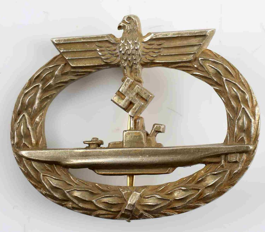 WWII GERMAN THIRD REICH SILVER UBOAT BADGE: Gold toned frosted, 800 silver officer's U-boat badge. Reverse marked 800 silver and "Schwerin Berlin 68." In very good condition. This lot has a reserve.