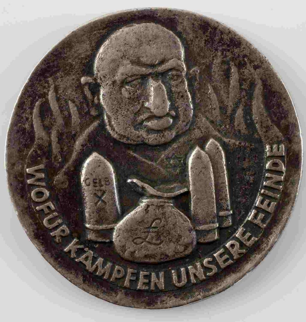 WWII GERMAN REICH ANTI SEMITIC SILVER MEDALLION: WWII German Third Reich Anti-Semitic silver medallion. Composed of 800 silver. Stamped 1939. German soldier on the front with Jewish man on the rear. Some surface patina but very good condition. This 