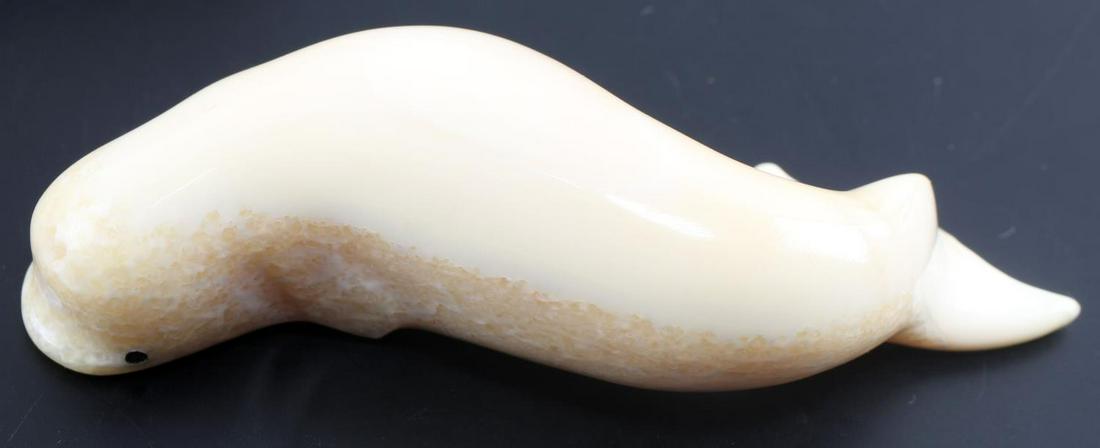 SMALL ALASKA WALRUS TUSK CARVED BELUGA WHALE: Small Inuit carved beluga whale. Measures 3 inches long. In very good condition.